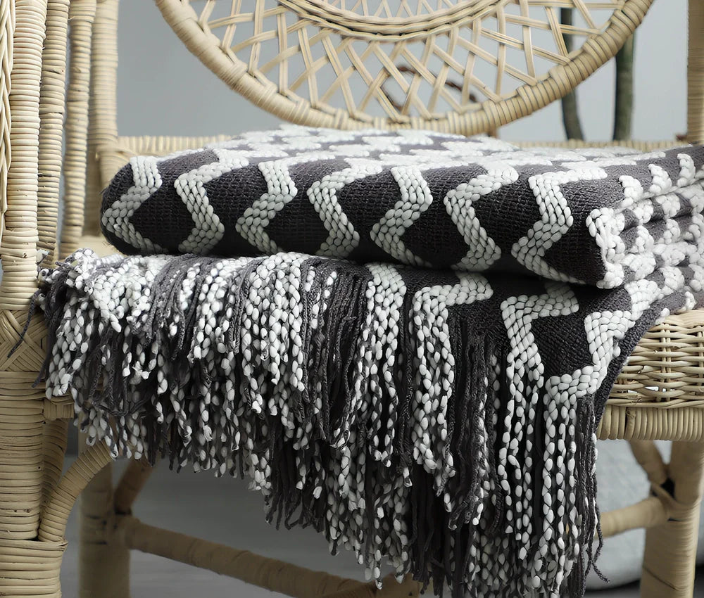 Nordic knitted decorative blanket with striped pattern and tassels in light grey colour