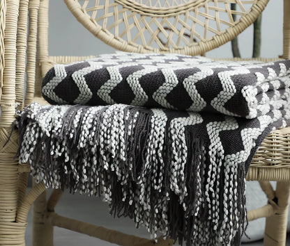 Nordic knitted decorative blanket with striped pattern and tassels in light grey colour