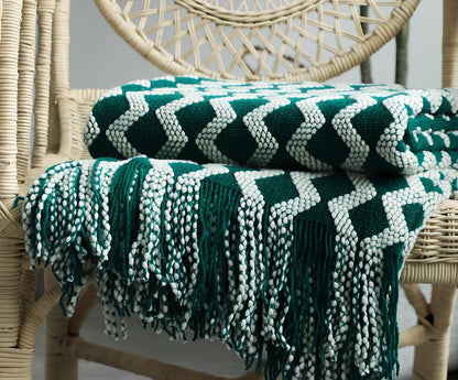 Nordic knitted decorative blanket with striped pattern and tassels in light grey colour