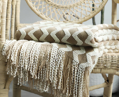 Nordic knitted decorative blanket with striped pattern and tassels in light grey colour