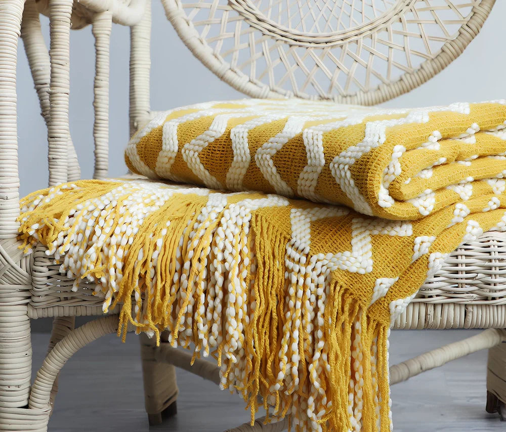 Nordic knitted decorative blanket with striped pattern and tassels in light grey colour