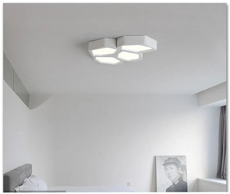 Geometric shaped LED light with iron shade in black or white frame, measuring 38×26cm with remote control