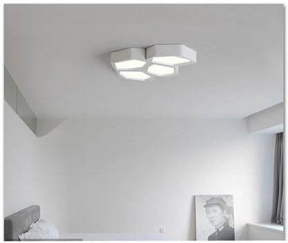 Geometric shaped LED light with iron shade in black or white frame, measuring 38×26cm with remote control