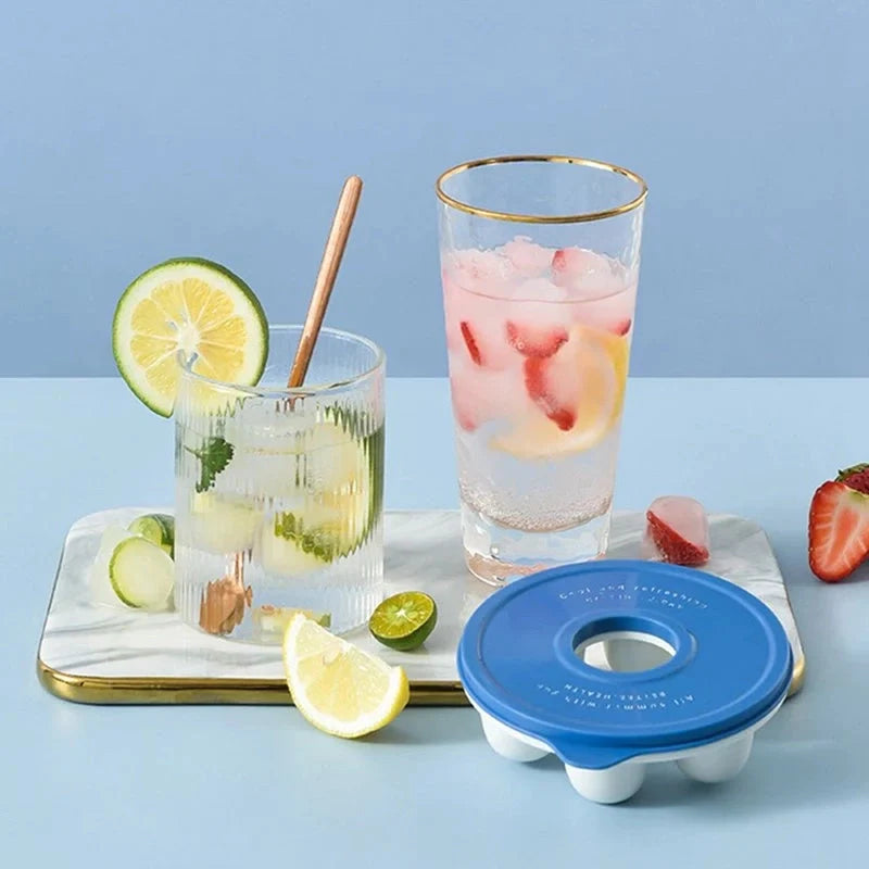 Donut-shaped ice cube molds in orange and blue, perfect for creative drink presentation.