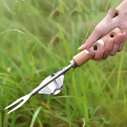 Stainless steel weeding tool with wood handle, curved metal base, and sharp forks for root extraction