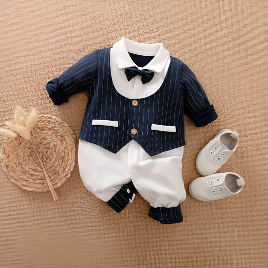 Baby boy in a long-sleeved cotton jumpsuit, gentleman style with collar, in navy blue colour.