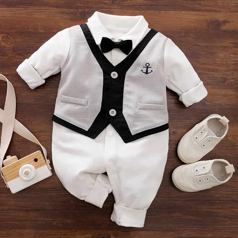 Baby boy in a long-sleeved cotton jumpsuit, gentleman style with collar, in navy blue colour.