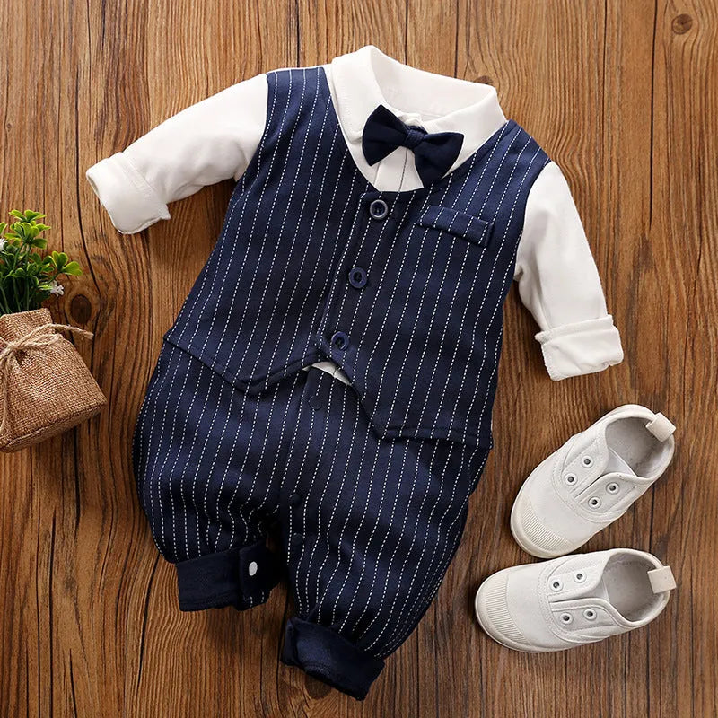 Baby boy in a long-sleeved cotton jumpsuit, gentleman style with collar, in navy blue colour.