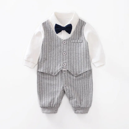 Baby boy in a long-sleeved cotton jumpsuit, gentleman style with collar, in navy blue colour.