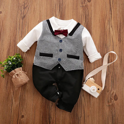 Baby boy in a long-sleeved cotton jumpsuit, gentleman style with collar, in navy blue colour.