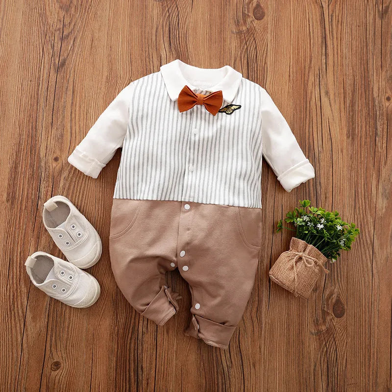 Baby boy in a long-sleeved cotton jumpsuit, gentleman style with collar, in navy blue colour.
