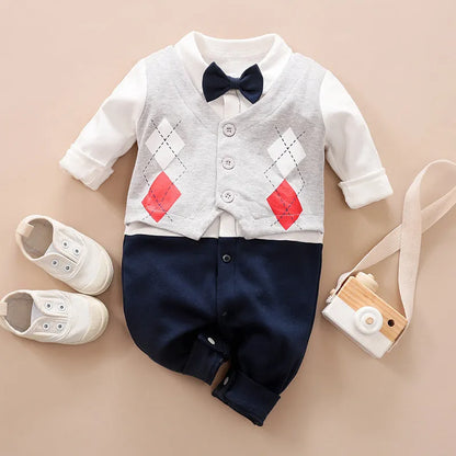 Baby boy in a long-sleeved cotton jumpsuit, gentleman style with collar, in navy blue colour.