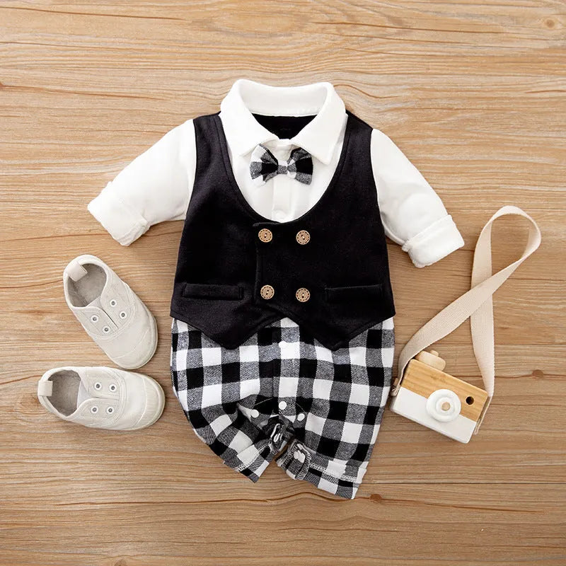 Baby boy in a long-sleeved cotton jumpsuit, gentleman style with collar, in navy blue colour.