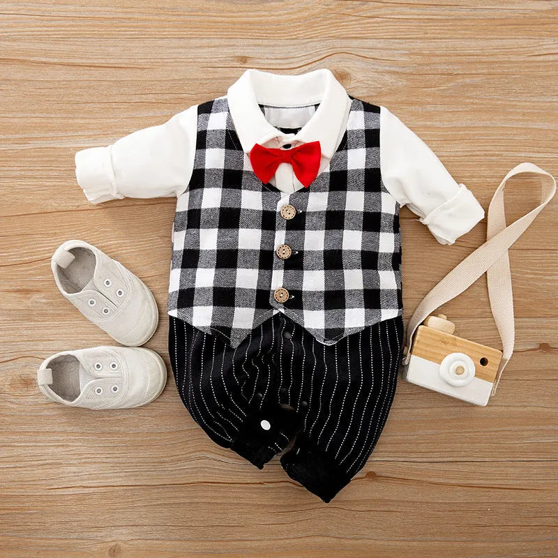 Baby boy in a long-sleeved cotton jumpsuit, gentleman style with collar, in navy blue colour.