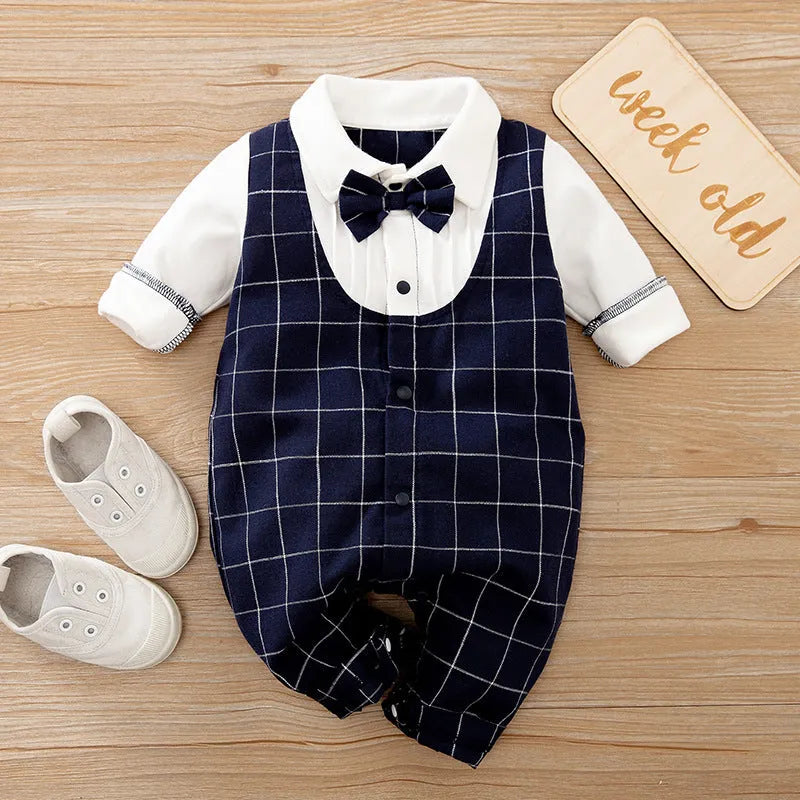 Baby boy in a long-sleeved cotton jumpsuit, gentleman style with collar, in navy blue colour.