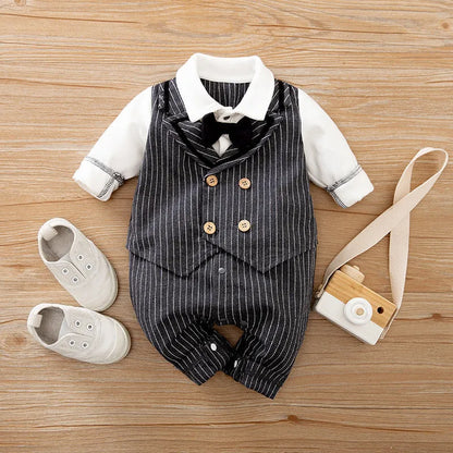 Baby boy in a long-sleeved cotton jumpsuit, gentleman style with collar, in navy blue colour.