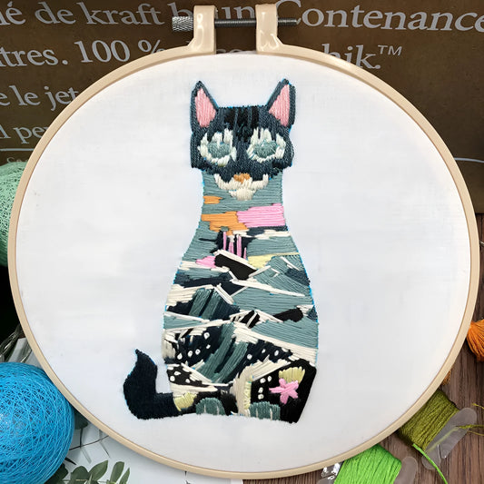 Beginners DIY embroidery kit showing materials for a three-dimensional cat cross stitch design on 20cm cotton linen fabric.
