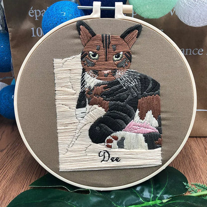 Beginners DIY embroidery kit showing materials for a three-dimensional cat cross stitch design on 20cm cotton linen fabric.