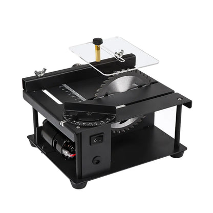Black miniature precision table saw with 110mm blade on sliding table for woodworking