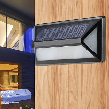 Black solar-powered wall light with 33 LED bulbs for outdoor illumination