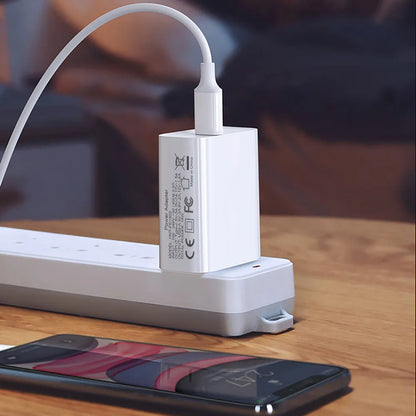 White 18W PD fast charging plug with dual USB-C ports, showing UK, US, and EU plug style options.