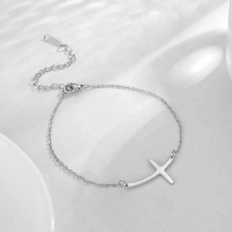 Classic stainless steel cross pendant bracelet with adjustable length for a versatile, refined American look