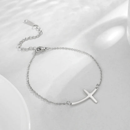 Classic stainless steel cross pendant bracelet with adjustable length for a versatile, refined American look