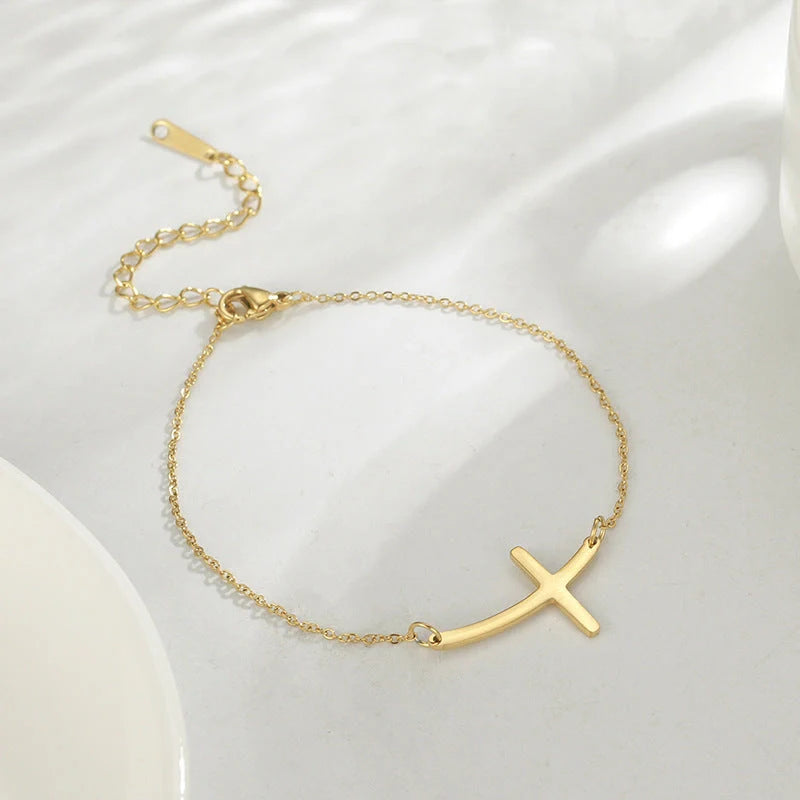 Classic stainless steel cross pendant bracelet with adjustable length for a versatile, refined American look