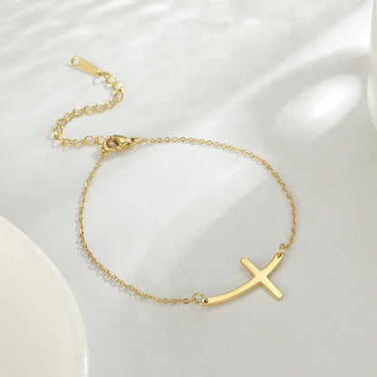 Classic stainless steel cross pendant bracelet with adjustable length for a versatile, refined American look