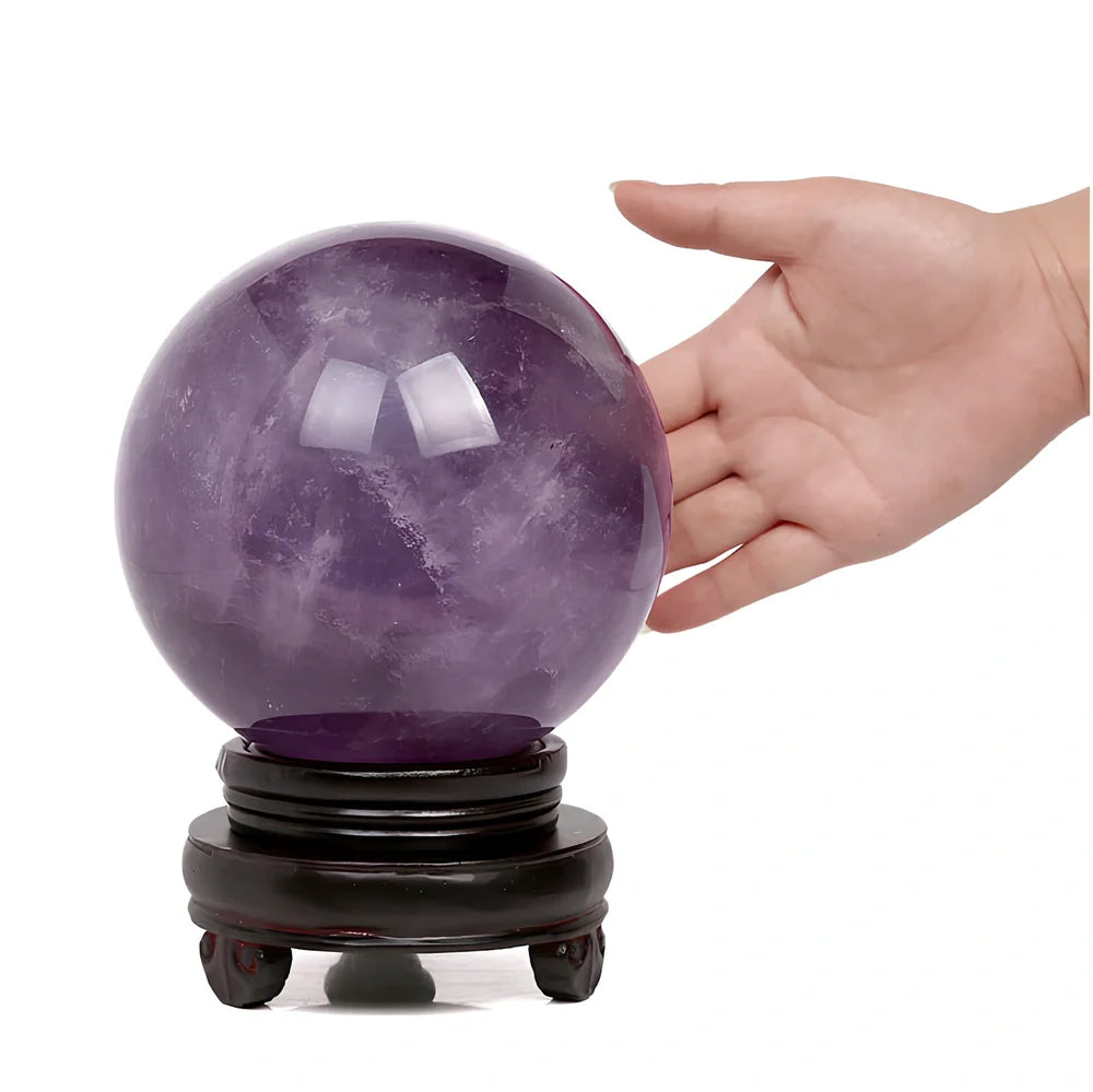 Natural purple amethyst crystal ball with polished surface in geometric sphere form