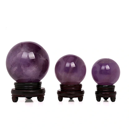 Natural purple amethyst crystal ball with polished surface in geometric sphere form