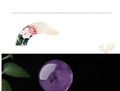 Natural purple amethyst crystal ball with polished surface in geometric sphere form