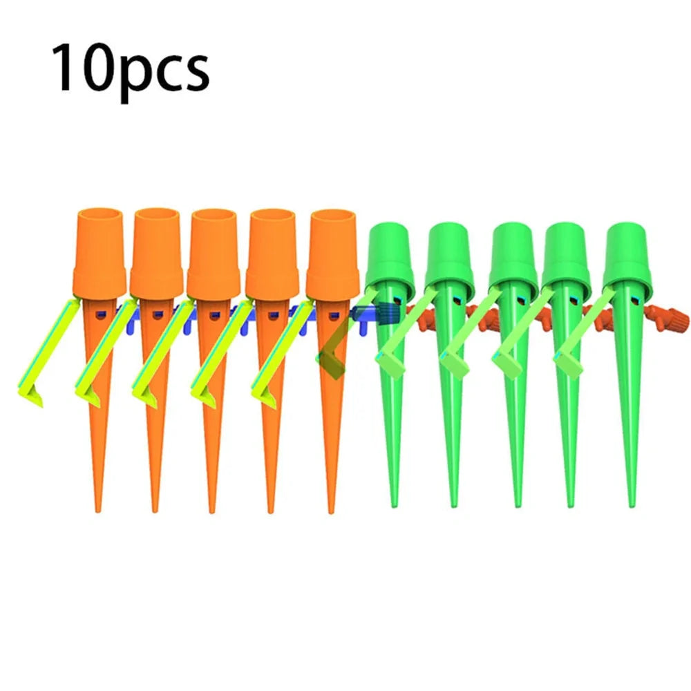 Set of green and orange plastic watering spikes, 16.5 cm tall, for garden plant hydration