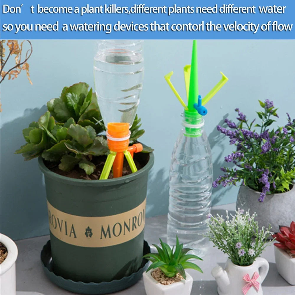 Set of green and orange plastic watering spikes, 16.5 cm tall, for garden plant hydration