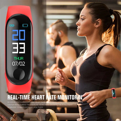 M3 Smart Bracelet with 0.96-inch colour screen on wrist, showing heart rate and step data in black, red, or blue.