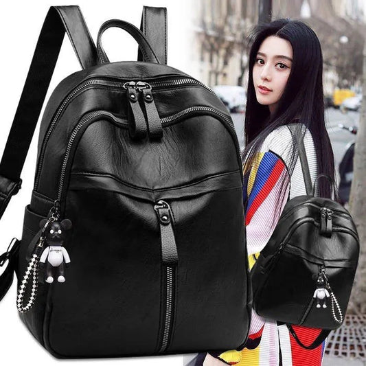 Black PU leather backpack with double straps showing ID compartment and zipper opening