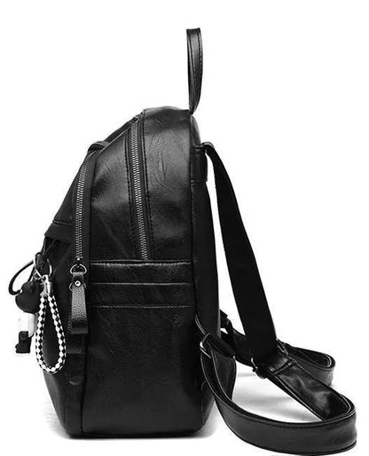 Black PU leather backpack with double straps showing ID compartment and zipper opening