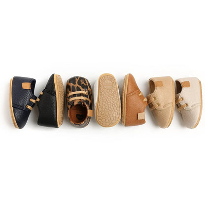 Soft leather baby moccasins with anti-slip rubber soles in beige colour showing low height design