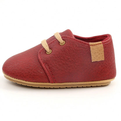 Soft leather baby moccasins with anti-slip rubber soles in beige colour showing low height design