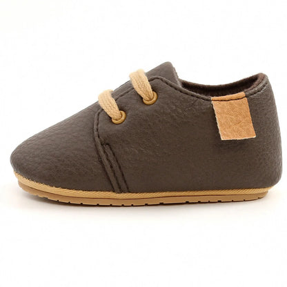 Soft leather baby moccasins with anti-slip rubber soles in beige colour showing low height design