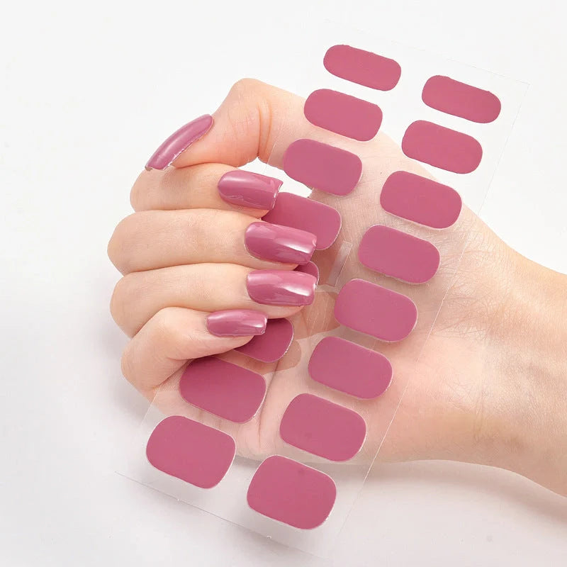 A collection of vibrant solid color nail art stickers in various designs