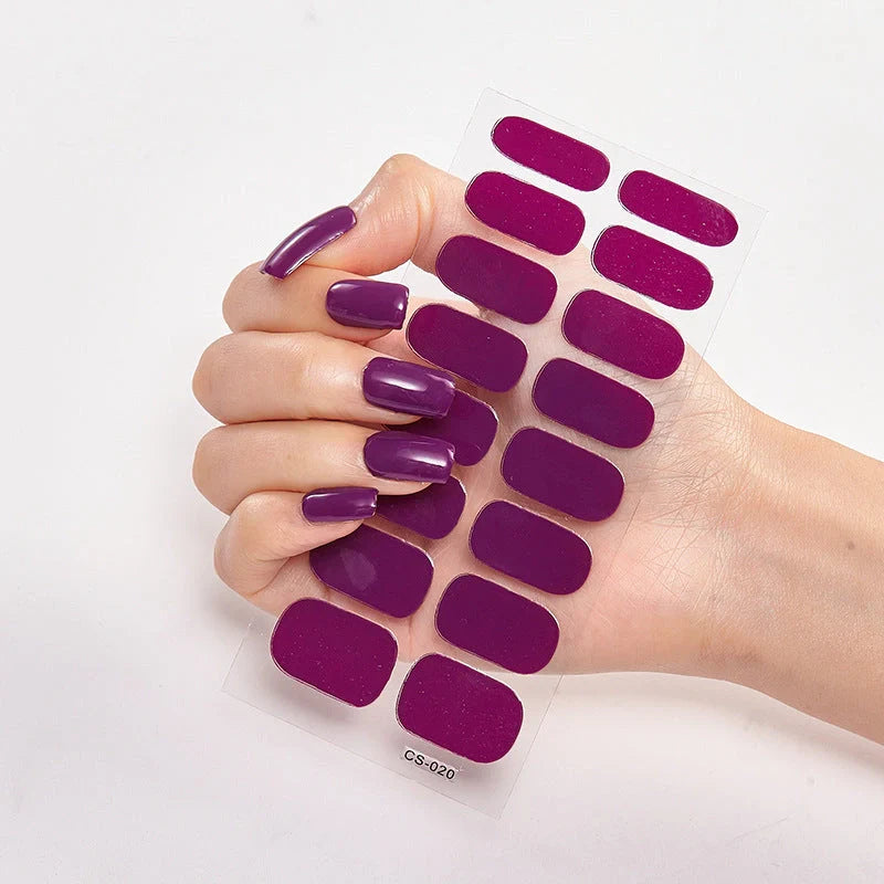 A collection of vibrant solid color nail art stickers in various designs