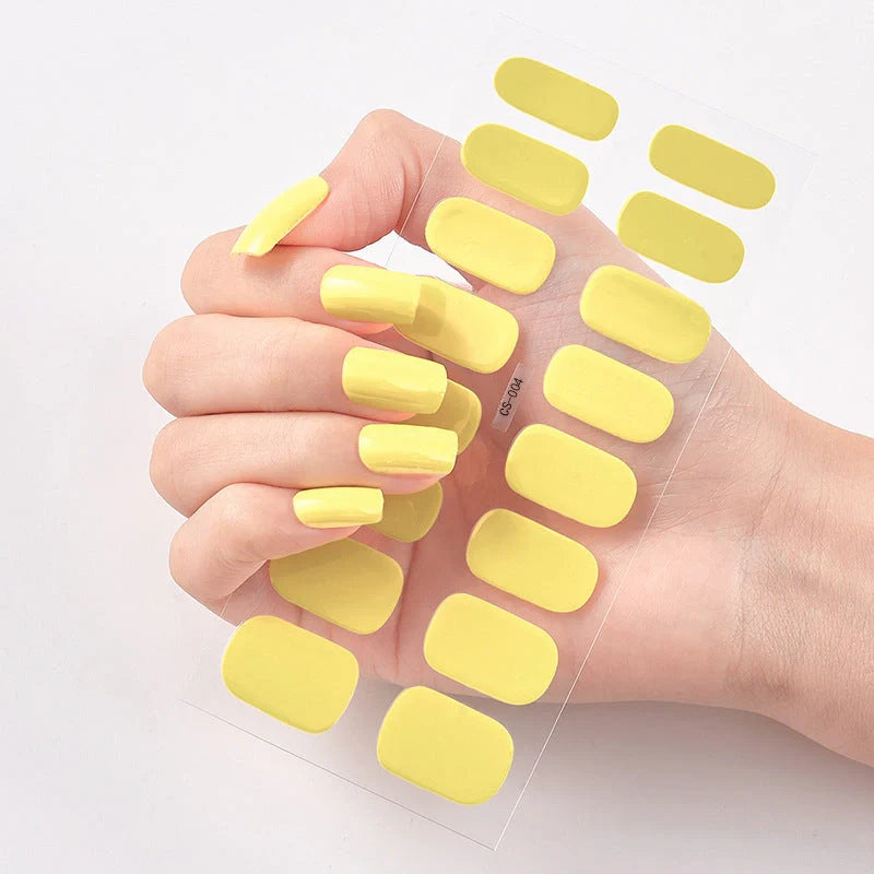A collection of vibrant solid color nail art stickers in various designs