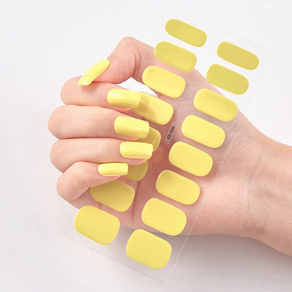 A collection of vibrant solid color nail art stickers in various designs