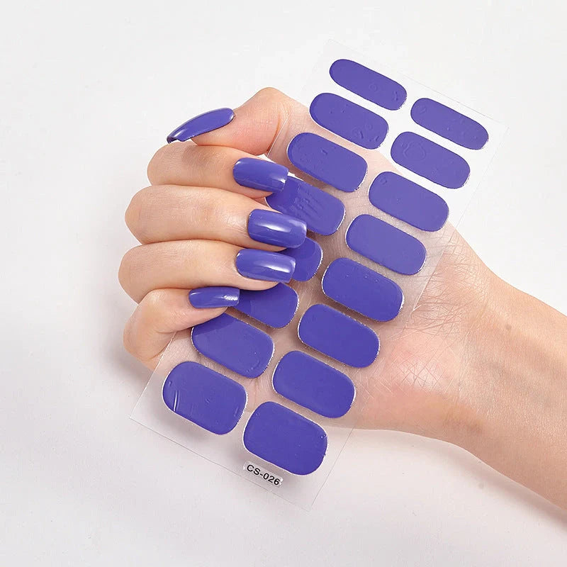 A collection of vibrant solid color nail art stickers in various designs