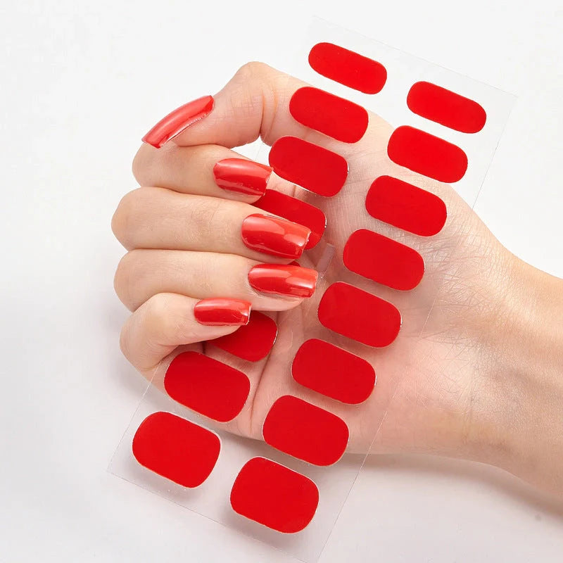 A collection of vibrant solid color nail art stickers in various designs