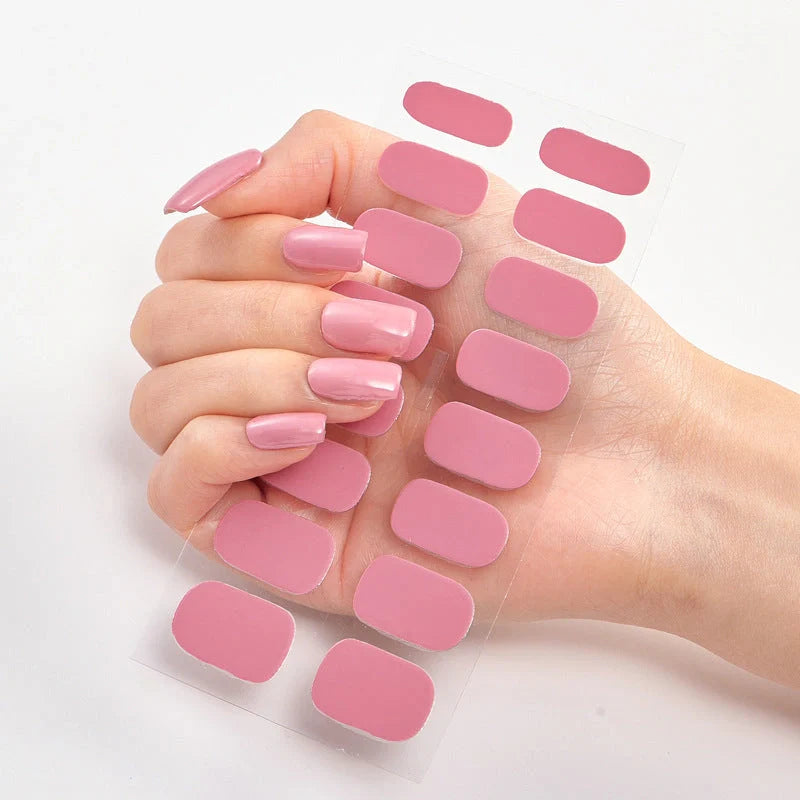 A collection of vibrant solid color nail art stickers in various designs