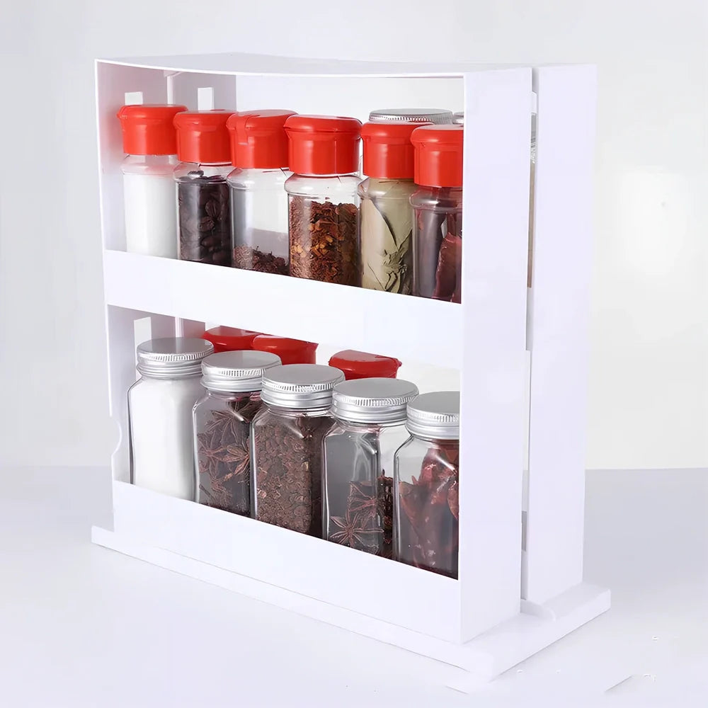White rotating kitchen spice rack with two tiers holding multiple spice containers