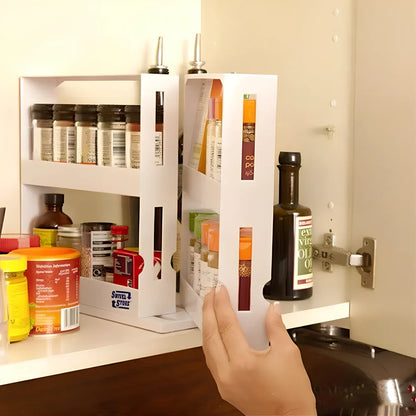 White rotating kitchen spice rack with two tiers holding multiple spice containers