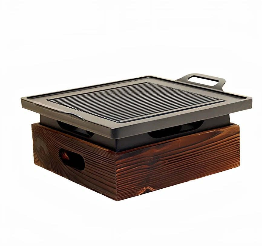 Korean baking pan set with four different sized pans in wooden storage block